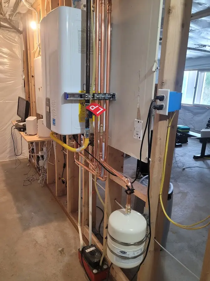Licensed plumber repairing a kitchen sink in Dansville